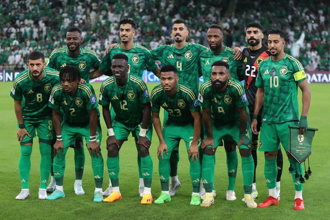 The Saudi Arabia team take a photo before their World Cup qualifier against Bahrain.