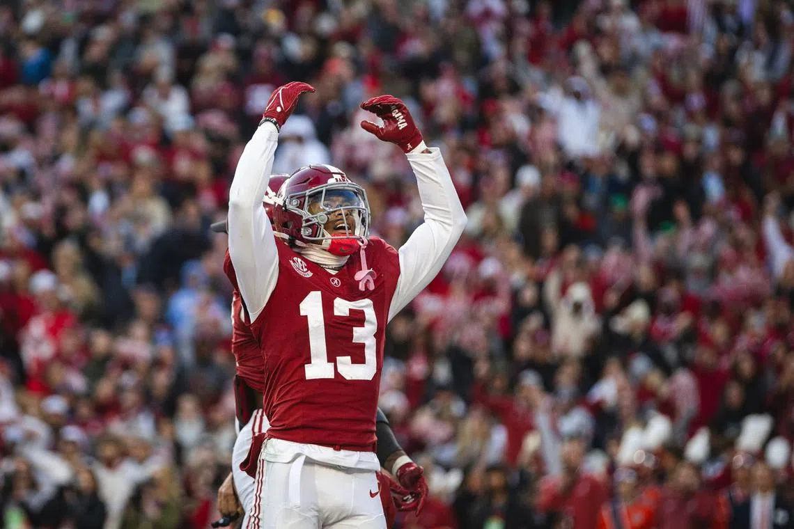 Nov 30, 2024; Tuscaloosa, Alabama, USA; Alabama Crimson Tide defensive back Malachi Moore (13) celebrates after a play against the Auburn Tigers during the second quarter at Bryant-Denny Stadium. Will McLelland-Imagn Images/File Photo