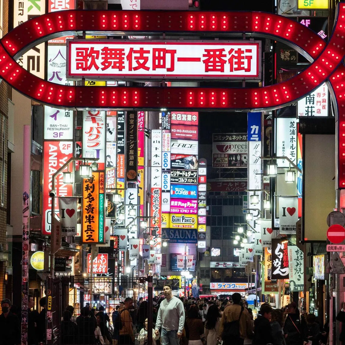 A large neon sign in the Shinjuku district in Tokyo. Shinjuku Ward will enforce a revised ordinance from October that adds food containers and disposable wooden chopsticks to prohibited litter.