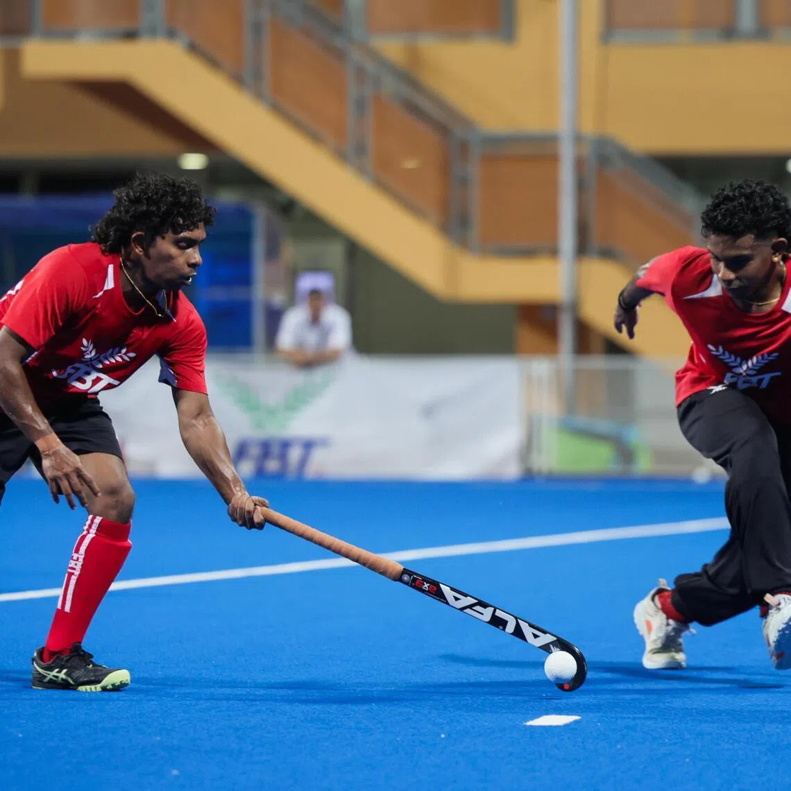 Midfielders Dineshraj Naidu (left) and his brother, co-captain Hariraj Naidu during a training session at Sengkang Hockey Stadium on April 30.