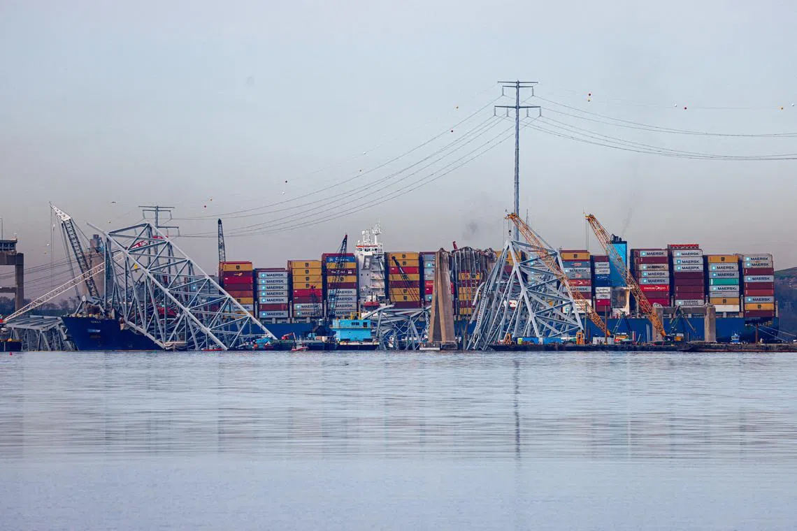 FILE PHOTO: Wreckage of the collapsed Francis Scott Key Bridge lies atop the container ship Dali as salvage work continues in Baltimore, Maryland, U.S., April 8, 2024. REUTERS/Julia Nikhinson/File Photo