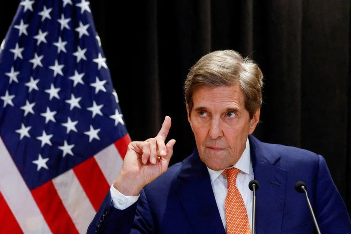 FILE PHOTO: John Kerry, the U.S. special envoy on climate issues, gestures as he attends a press conference in Beijing, China, July 19, 2023. REUTERS/Thomas Peter