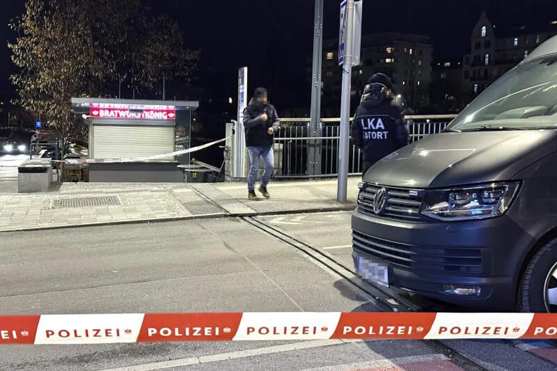 Officers of the Austrian State Criminal Police are seen near a police cordon after a knife attack near the main square in the city centre of Villach, southern Austria on February 15, 2025. A 14-year-old boy died and four other people were injured in the knife attack in southern Austria on February 15, police said, adding they have arrested a 23-year-old Syrian asylum seeker. (Photo by GERD EGGENBERGER / APA / AFP) / Austria OUT