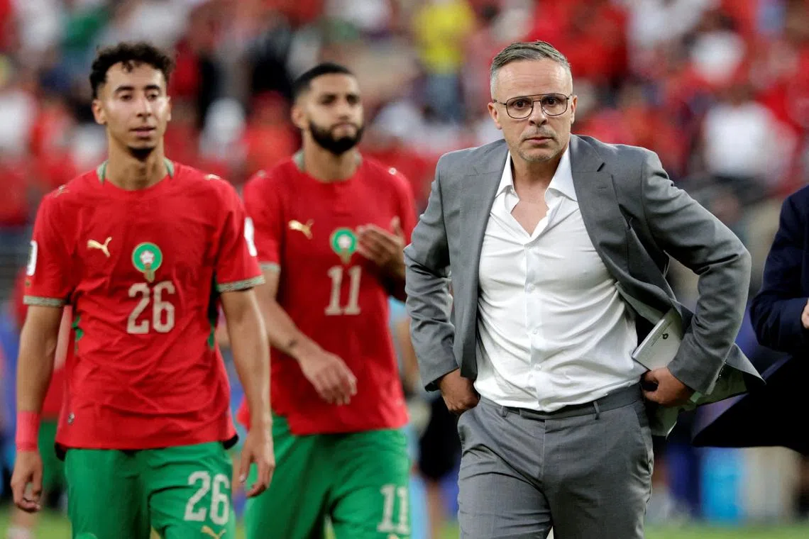 Soccer Football - FIFA World Cup 2026 - Group C - Brazil v Morocco - New York/New Jersey Stadium, East Rutherford, New Jersey, U.S. - June 13, 2026 Morocco coach Mohamed Ouahbi with their players after the match  REUTERS/Jeenah Moon REFILE - CORRECTING EVENT