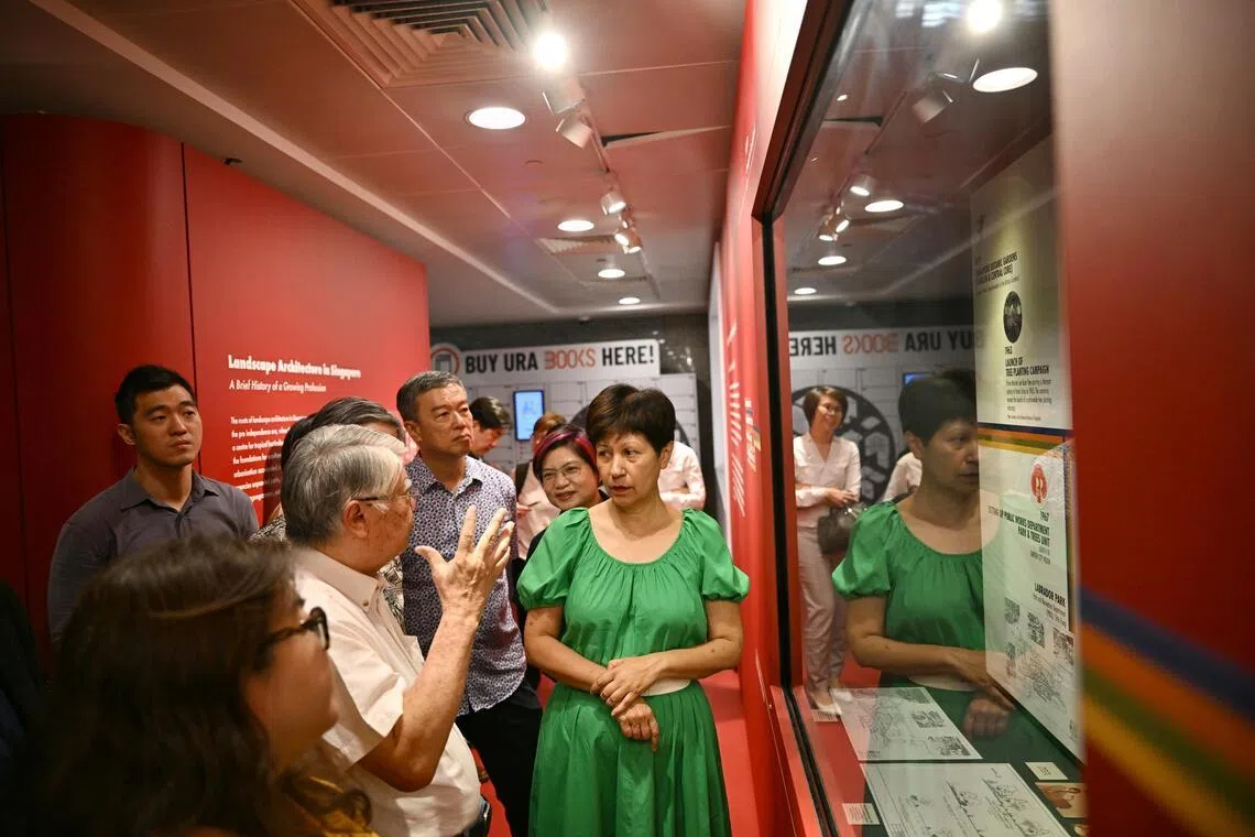 Second Minister for National Development Indranee Rajah (in green) speaks with pioneer landscape architect Otto Fung (in white) at the Singapore Landscape Architecture Exhibition on March 16.