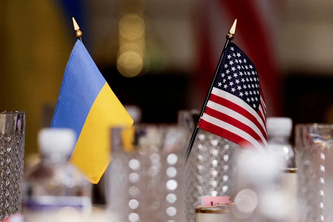 FILE PHOTO: Flags of Ukraine and U.S. are pictured during a meeting between the U.S. Secretary of Defense Lloyd Austin and Ukrainian Defense Minister Rustem Umerov at the Pentagon, in Washington, U.S., August 30, 2024. REUTERS/Daniel Becerril/File Photo