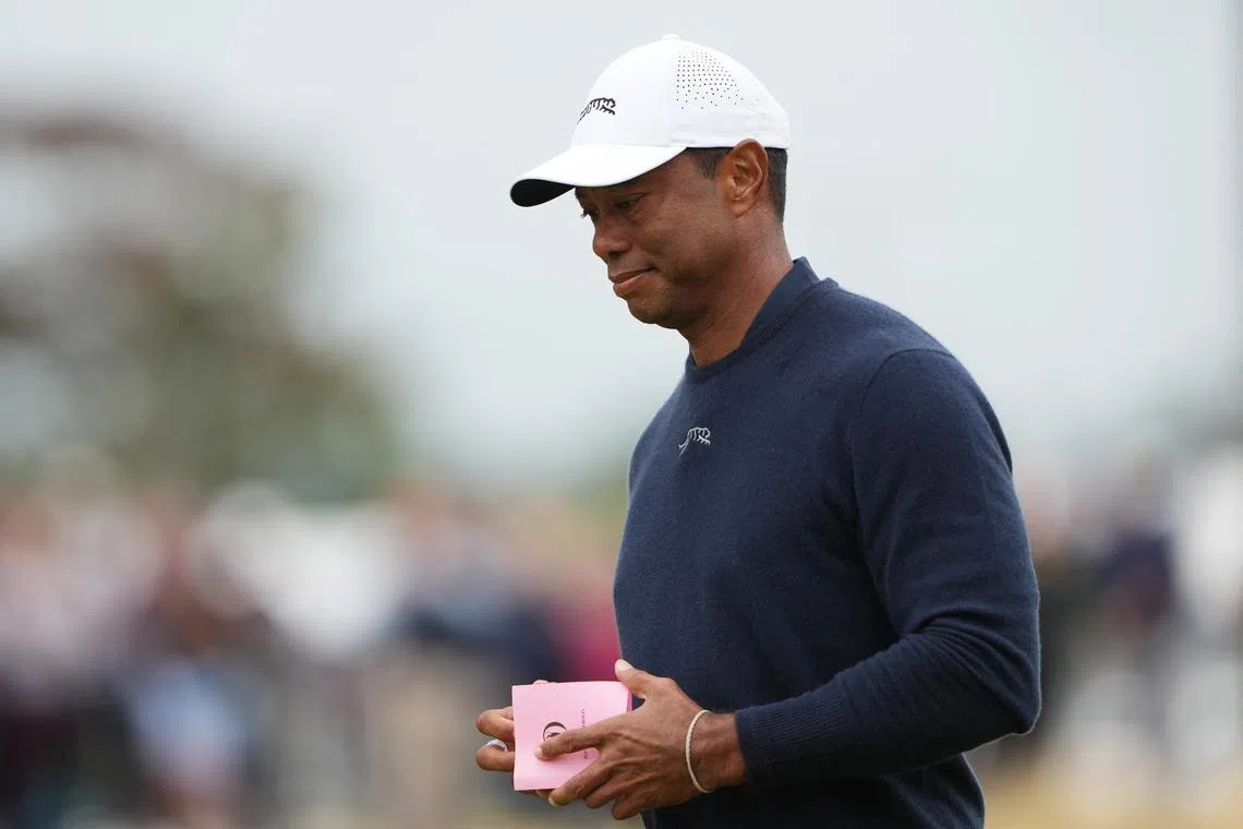 FILE PHOTO: Golf - The 152nd Open Championship - Royal Troon Golf Club, Troon, Scotland, Britain - July 19, 2024 Tiger Woods of the U.S. at the 18th green after finishing his second round REUTERS/Maja Smiejkowska/File Photo