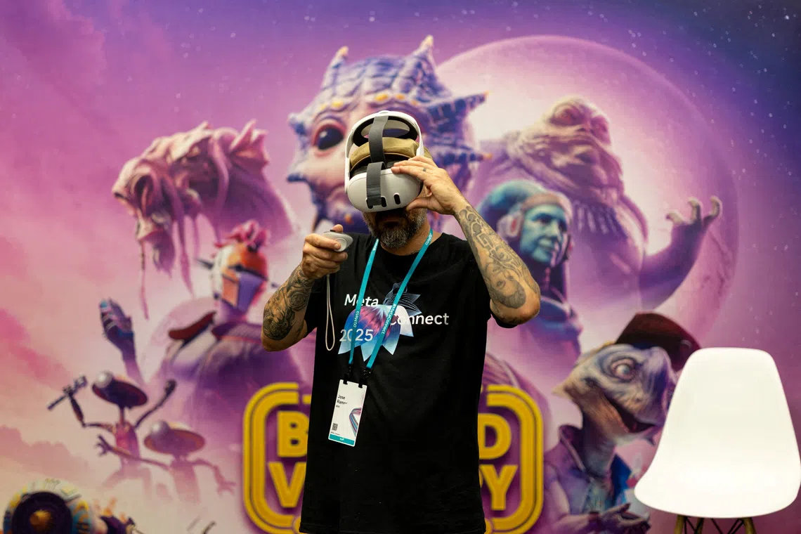 An employee experiencing virtual reality devices during the Meta annual Connect conference at the company's headquarters in Menlo Park, California, U.S. on Sept 16, 2025. 