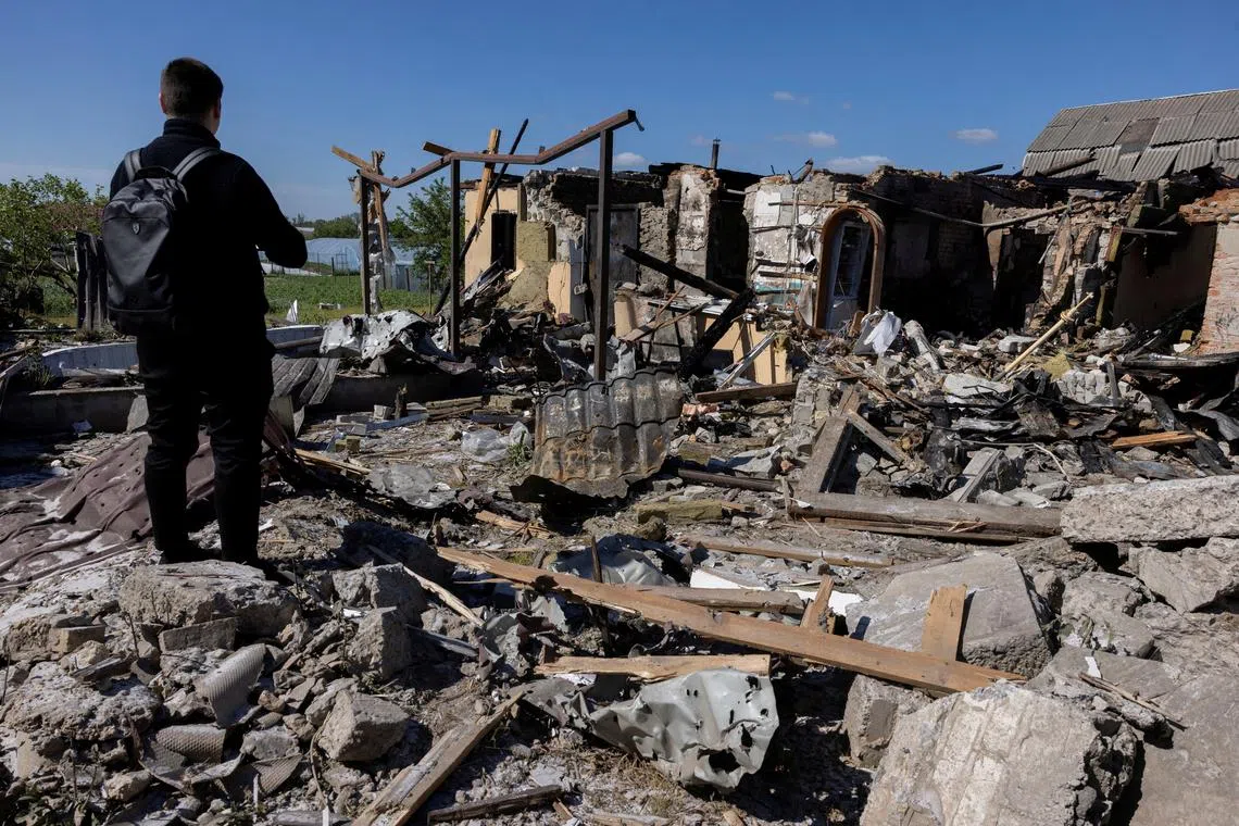 A man surveys the damage of a house that was hit during a Russian missile strike in Krasylivka, Kyiv region, Ukraine, amid Russia’s attack on Ukraine, May 8, 2024. REUTERS/Thomas Peter/File Photo