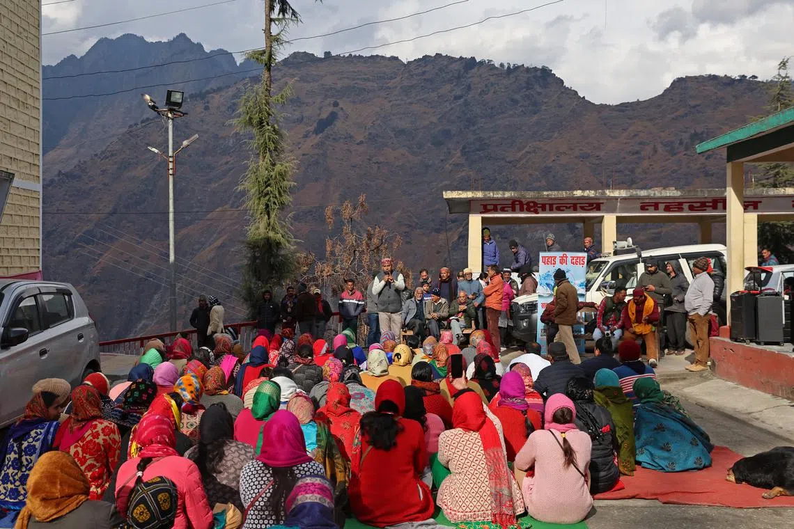 Residents protest against NTPC, the government's largest power producer, at a local administrative building, after cracks developed inside their houses following rapid urban expansion, in Joshimath, in the northern state of Uttarakhand, India, Jan 13, 2023. 