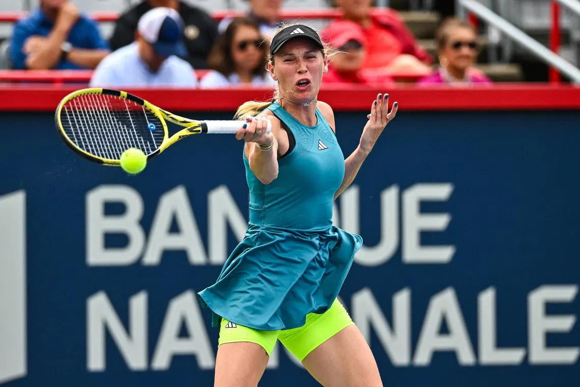 Caroline Wozniacki hitting a return to Kimberly Birrell during their first-round clash at the Canadian Open.