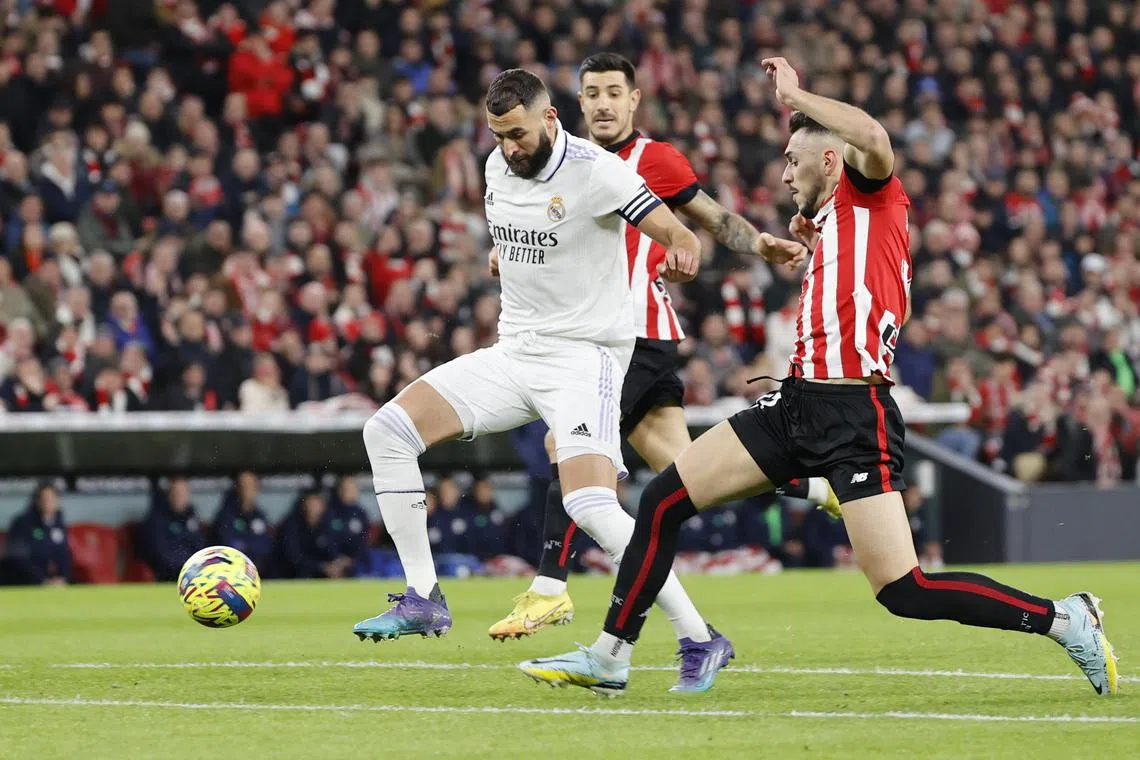 Real Madrid's Karim Benzema (L) in action during the Spanish La Liga match between Athletic Bilbao and Real Madrid.