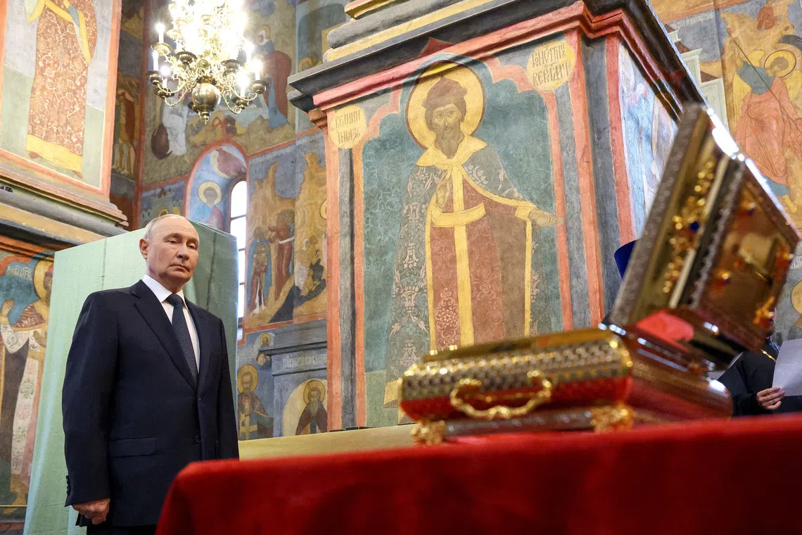 Russian President Vladimir Putin stands by the relics of the Holy Grand Prince Dmitry Donskoy, which were discovered in the course of restoration works, during a service at the Archangel Cathedral of the Kremlin in Moscow, Russia August 20, 2026. Sputnik/Vyacheslav Prokofyev/Pool via REUTERS ATTENTION EDITORS - THIS IMAGE WAS PROVIDED BY A THIRD PARTY.