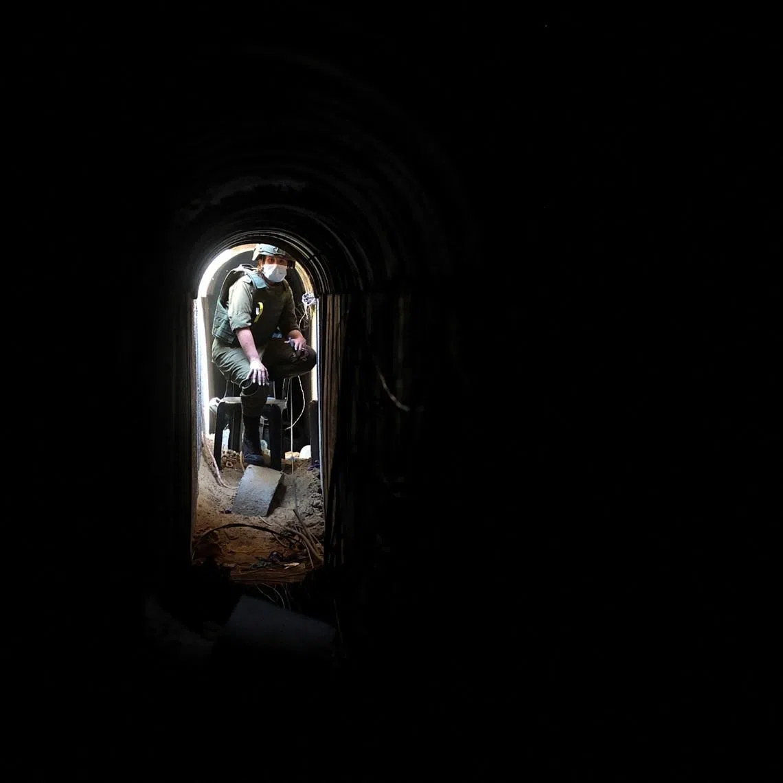 An Israeli soldier sits inside a tunnel underneath the European Hospital in Khan Younis at the Gaza Strip, amid the ongoing ground operation of the Israeli army against Palestinian Islamist group Hamas, June 8, 2025. REUTERS/Ronen Zvulun