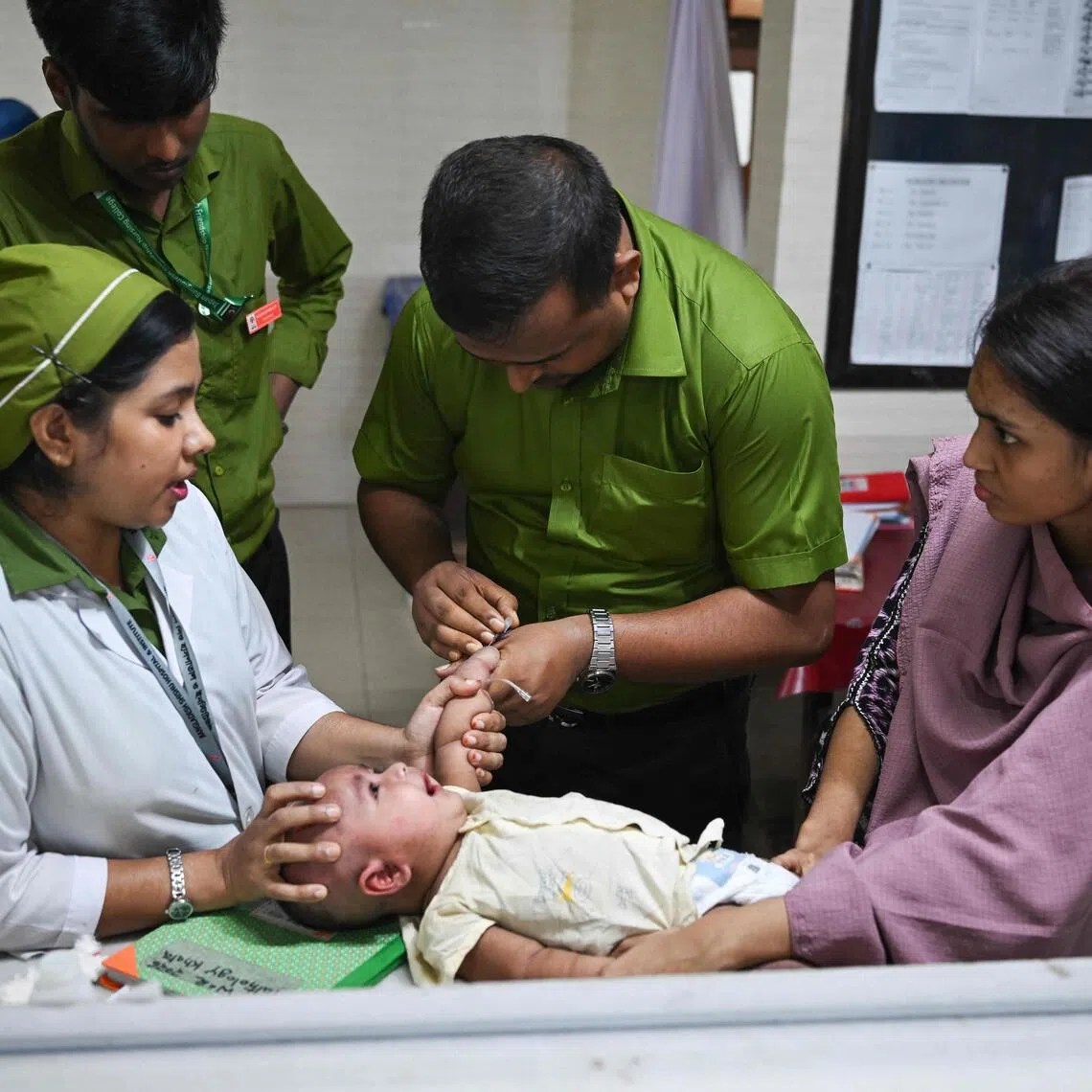 A child receiving treatment for measles at Bangladesh Shishu Hospital & Institute in Dhaka on Sept 3.