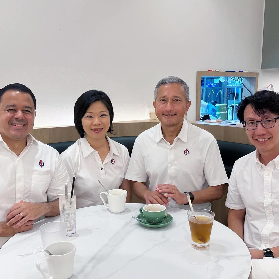 ST PHOTO : Syarafana Binte Muhammad Shafeeq(from left) MPs for Holland-Bukit Timah GRC Mr Christopher de Souza, Ms Sim Ann, Dr Vivian Balakrishnan and Mr Edward Chia at Bukit Panjang Plaza on May 4 during a sit-down chat with The Straits Times