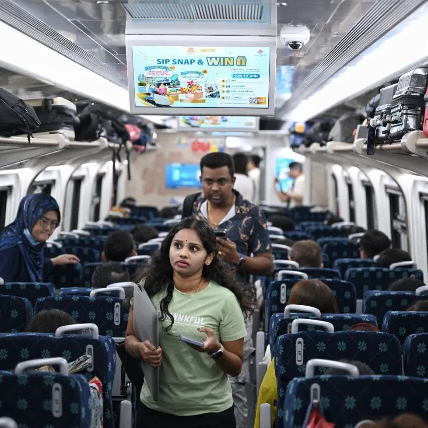Passengers boarding the first ETS from Johor Bahru to Kuala Lumpur on Dec 12.