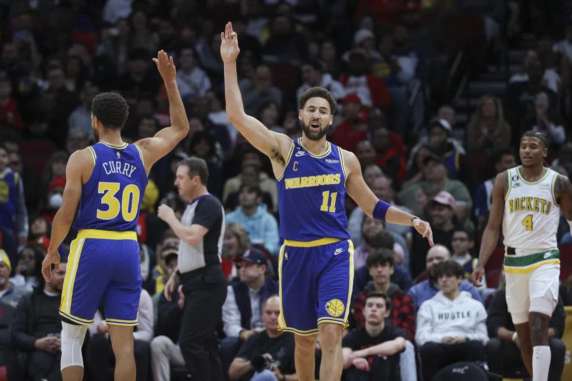 Golden State Warriors guards Stephen Curry (left) and Klay Thompson helped their team to a first road win this season.