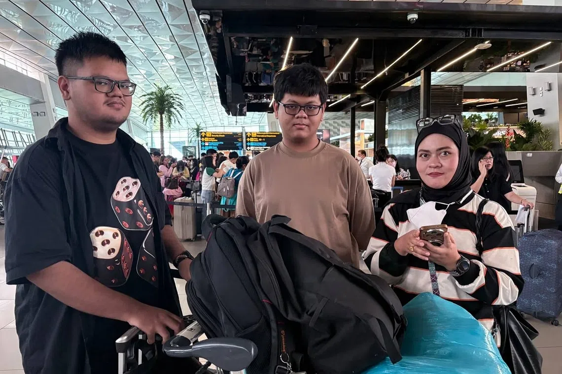 Zafran Aiman Kamil (centre), his mother Nana, and older brother Hafiz were set to go to Singapore for the commencement of Zafran’s studies at SUTD when their Singapore Airlines flight was cancelled due to the Anak Krakatau eruption.