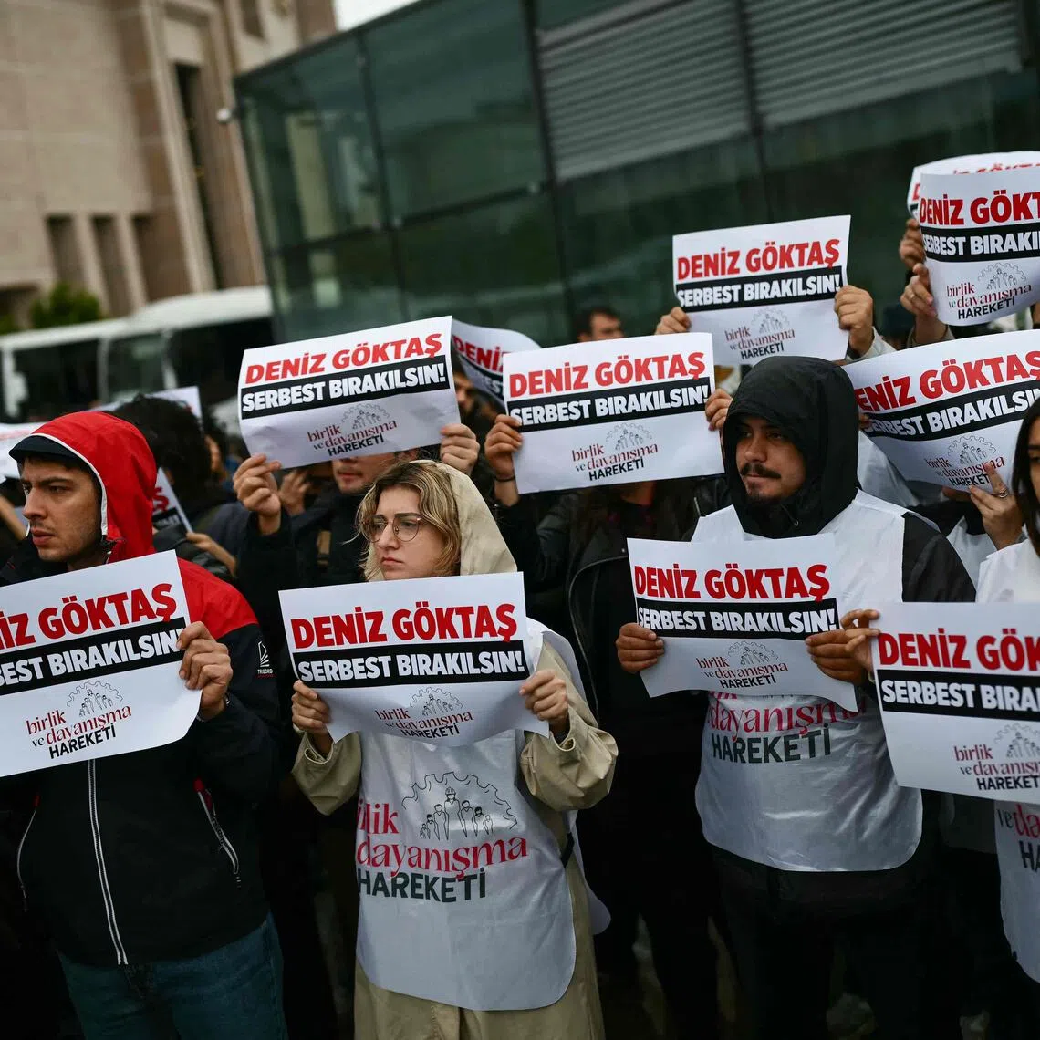 Protesters demanding the release of Turkish comedian Deniz Goktas on the opening day of his trial outside a courthouse in Istanbul on Sept 28.