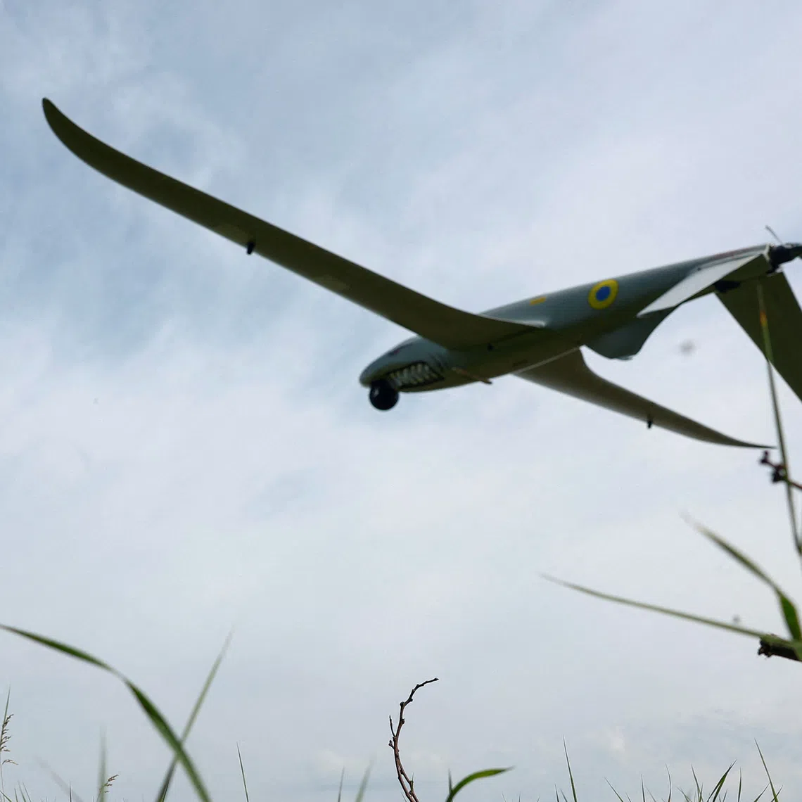 FILE PHOTO: A service member of the 422nd Unmanned Systems Regiment 'Luftwaffe' of the Ukrainian Armed Forces, looks at a Shark reconnaissance drone as it launches from a position near a front line, amid Russia's attack on Ukraine, in an undisclosed location in Southern Ukraine, on an undisclosed date, 2026. REUTERS/Valentyn Ogirenko/File Photo