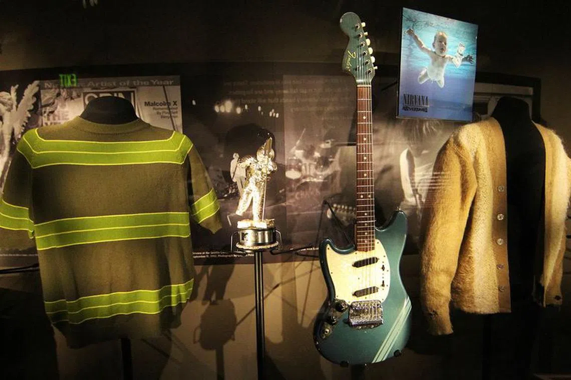FILE PHOTO: Rarely displayed memorabilia including iconic clothing and musical instruments of the late Kurt Cobain of the legendary grunge band Nirvana, are on display at the \"Nirvana: Taking Punk to the Masses\" exhibition of the Experience Music Project (EMP) in Seattle on April 15, 2011.  TREUTERS/Anthony Bolante/File Photo