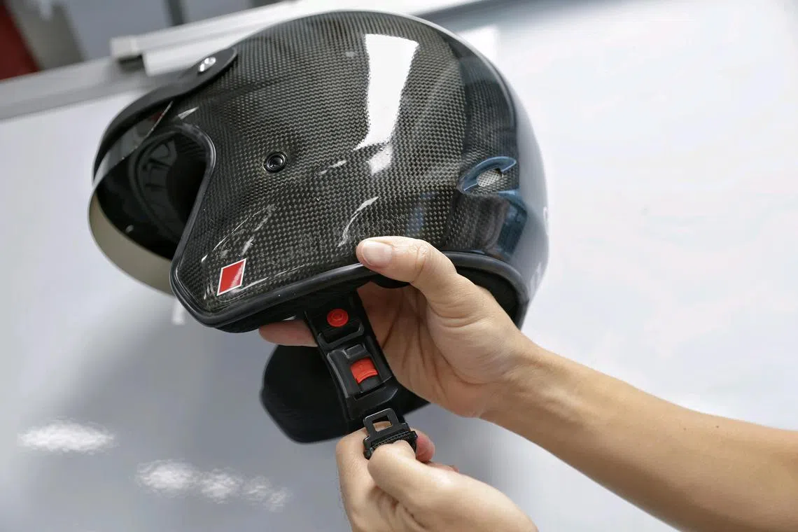 An example of a helmet with quick release mechanism pictured on Nov 22, 2024. Updated testing standard will allow motorcycle helmets with quick release mechanism to be approved in Singapore.