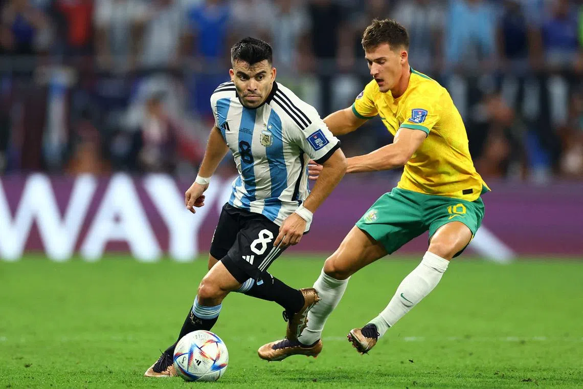 FILE PHOTO: Soccer Football - FIFA World Cup Qatar 2022 - Round of 16 - Argentina v Australia - Ahmad bin Ali Stadium, Al Rayyan, Qatar - December 3, 2022  Australia's Ajdin Hrustic in action with Argentina's Marcos Acuna REUTERS/Carl Recine