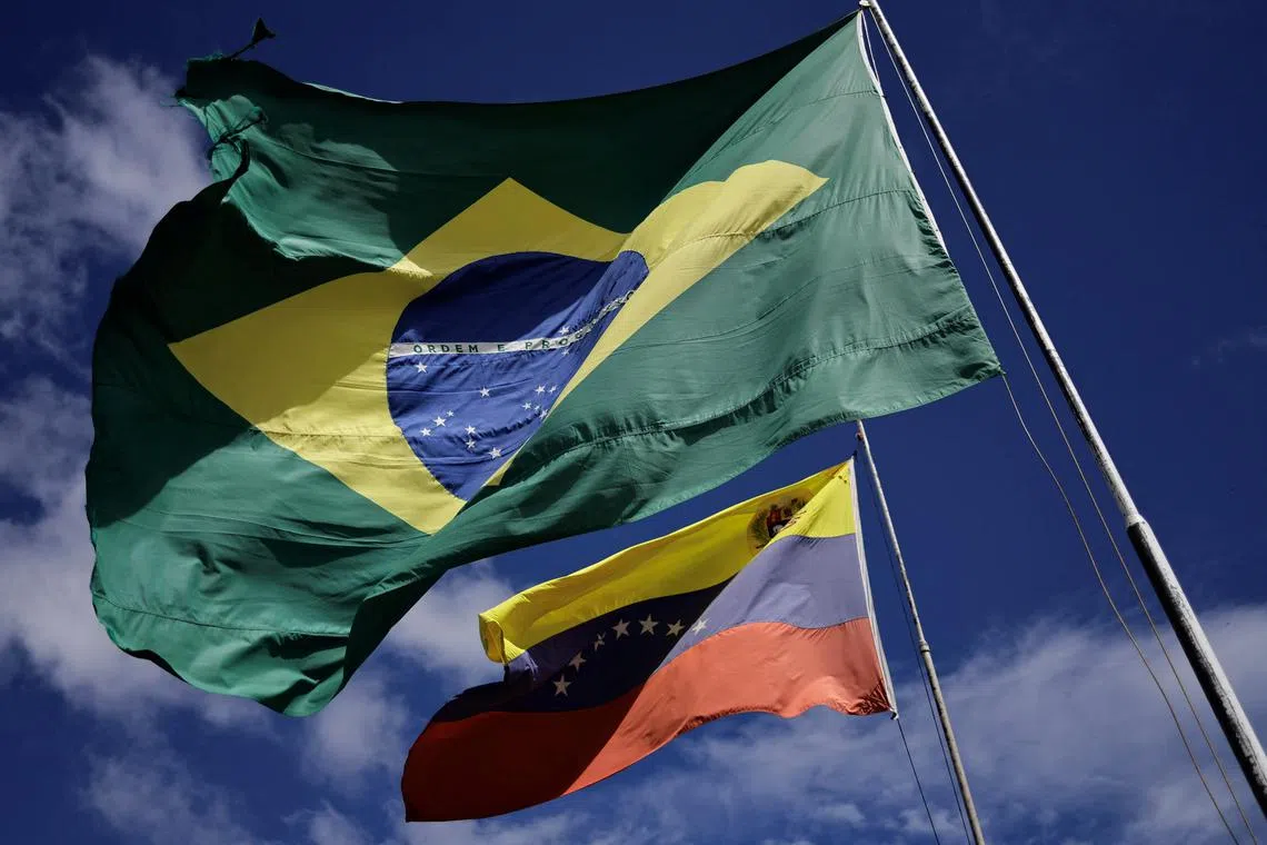 National flags of Brazil and Venezuela flutter at the Brazil-Venezuela border in the Brazilian city of Pacaraima, Roraima state, Brazil December 8, 2023. REUTERS/Ueslei Marcelino/File Photo