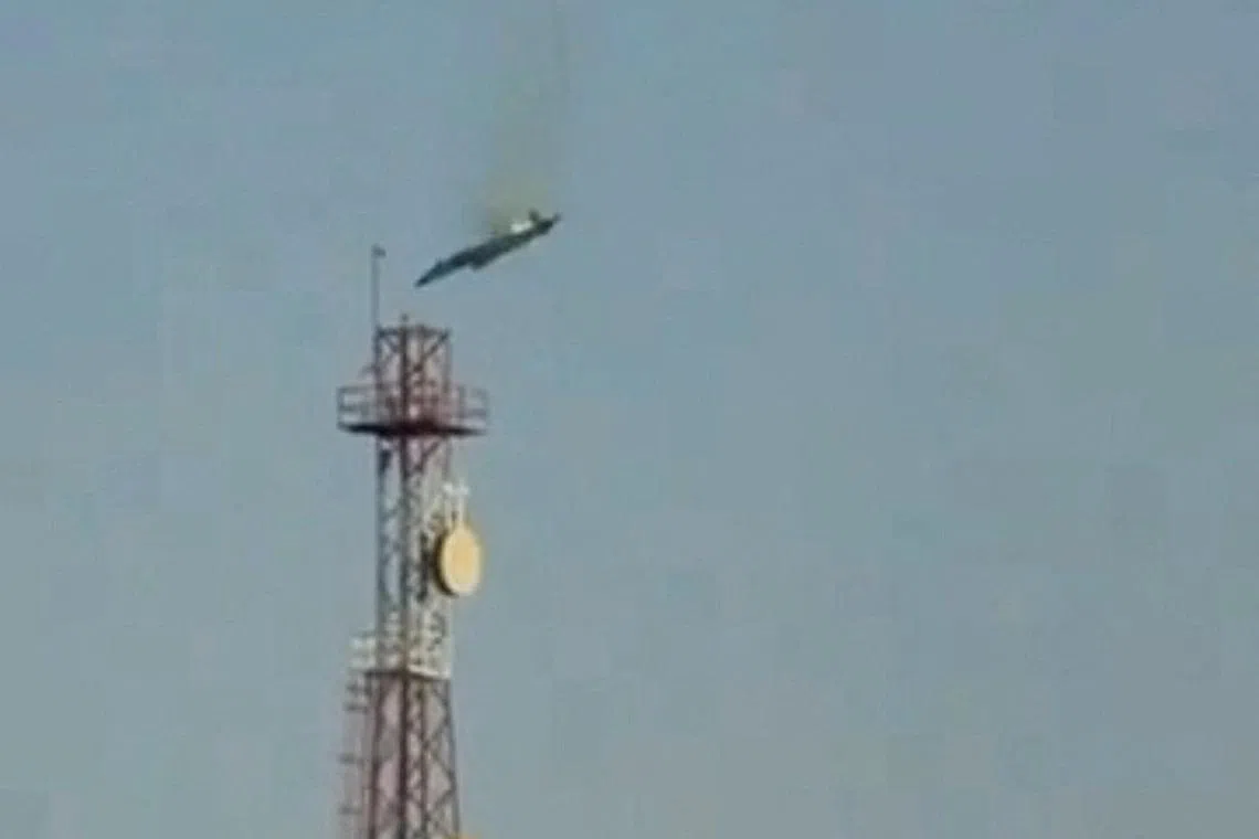 A burning aircraft falls from the sky in Al Jahra, Kuwait, in this still image obtained from social media video released on March 2, 2026. Social Media/via REUTERS