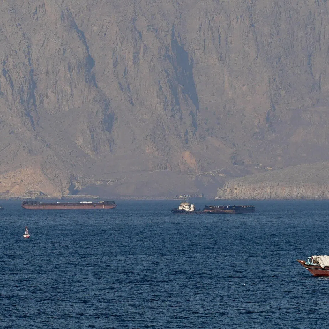 Ships and tankers in the Strait of Hormuz off the coast of Musandam, Oman, on April 18, 2026.
