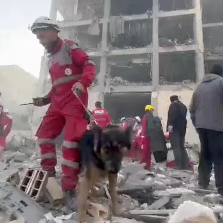 Rescuers work in the rubble of residential buildings after air strikes, in the Resalat neighbourhood, in Tehran, Iran.