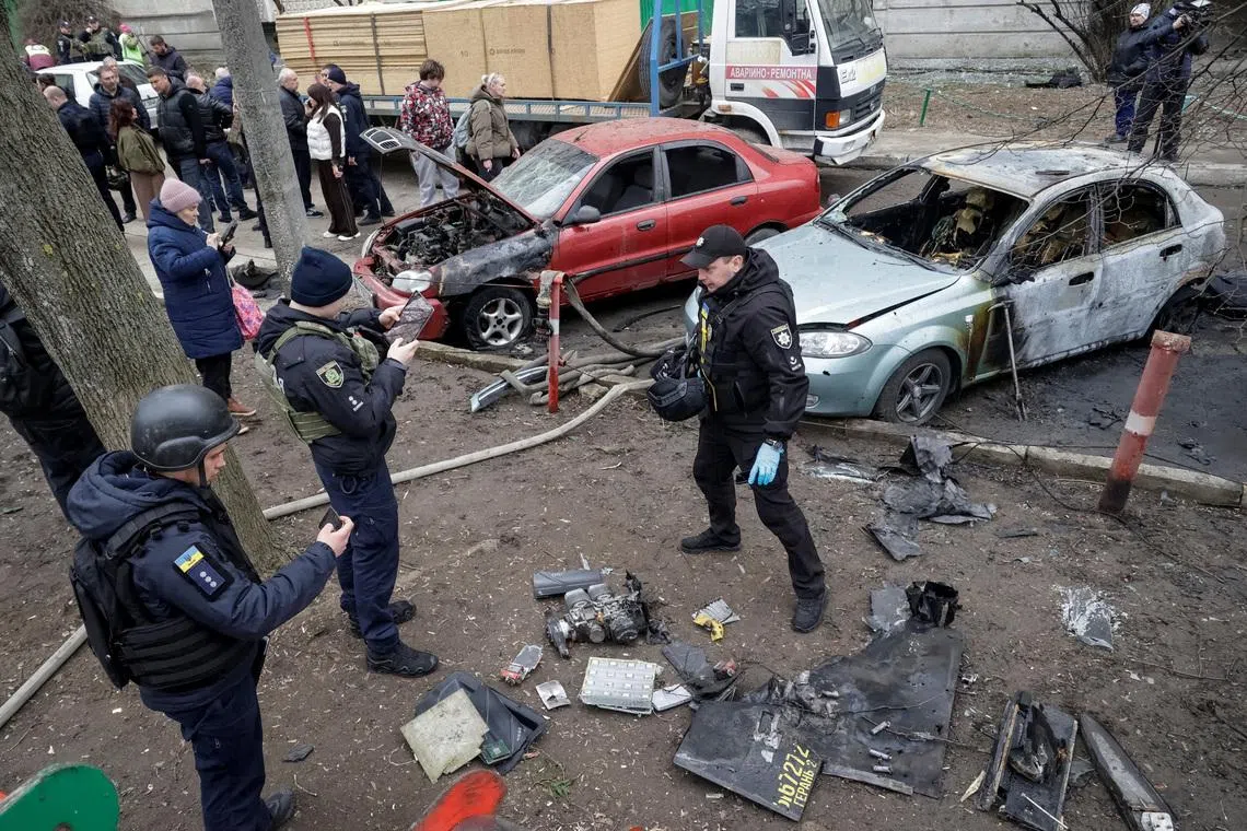 Police experts work at the site of a Russian drone strike, amid Russia's attack on Ukraine, in Kharkiv, Ukraine March 25, 2026.  REUTERS/Sofiia Gatilova