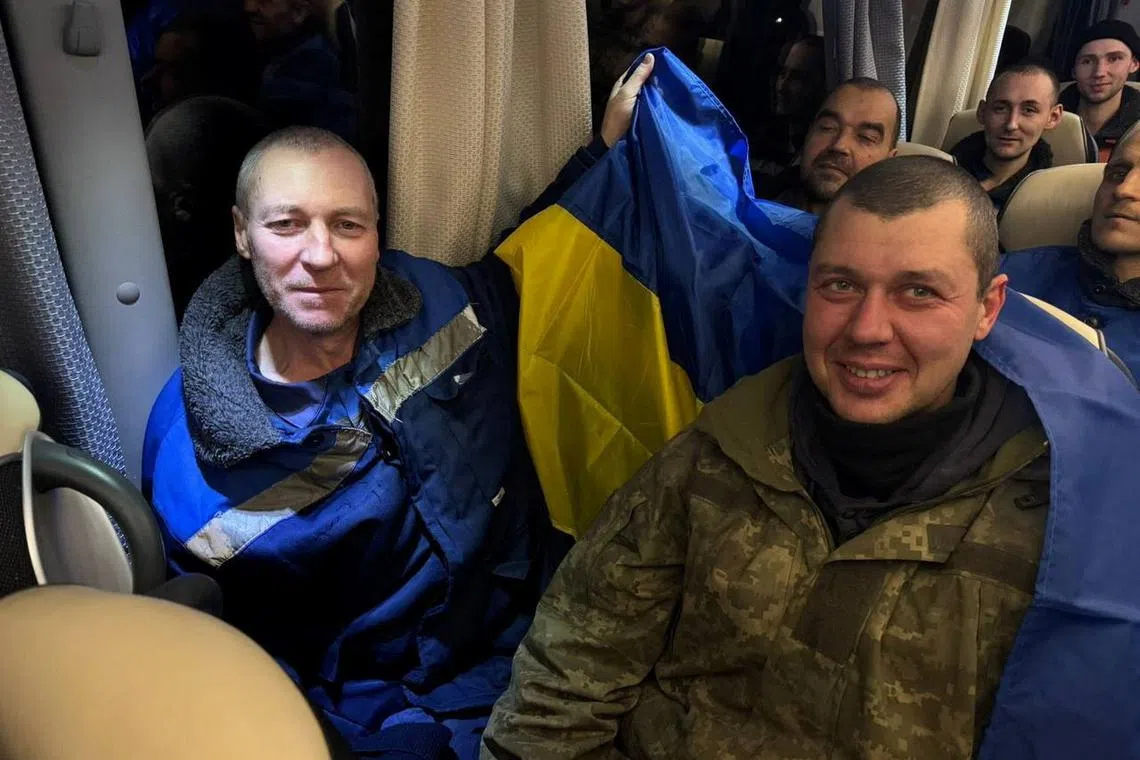 Ukrainian prisoners of war (POWs) react on a bus after a swap, amid Russia's attack on Ukraine, at an unknown location in Ukraine, in this handout picture released December 30, 2024. Ukraine's President Volodymyr Zelenskiy via Telegram/via REUTERS