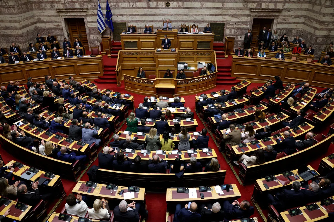 Greek Prime Minister Kyriakos Mitsotakis speaks at the Greek parliament as parliament votes on the 2026 budget, in Athens, Greece, December 16, 2025. REUTERS/Louiza Vradi
