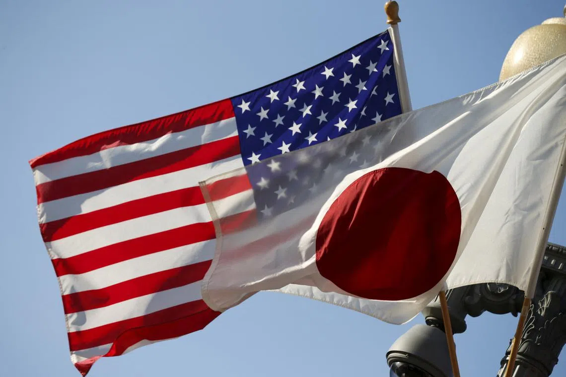 FILE PHOTO: The U.S. and Japan flags fly together outside the White House in Washington April 27, 2015. REUTERS/Kevin Lamarque/File Photo