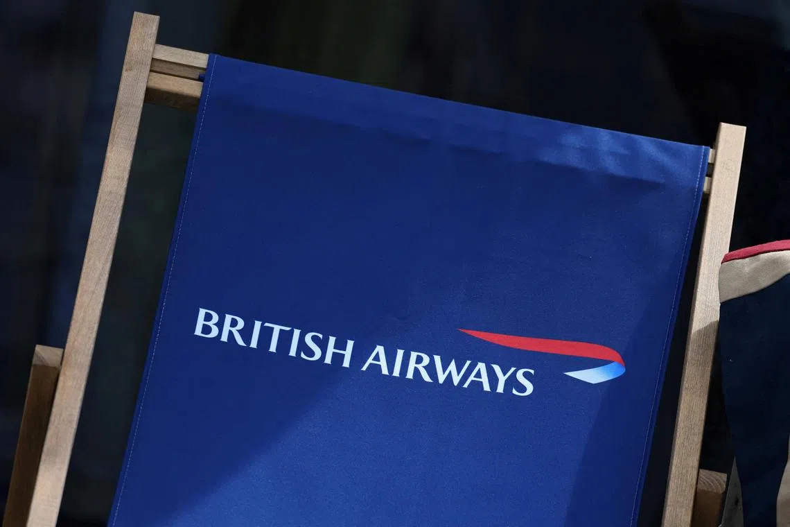 FILE PHOTO: British Airways branding is seen on a deckchair at the Farnborough International Airshow, in Farnborough, Britain, July 22, 2024. REUTERS/Toby Melville/File Photo