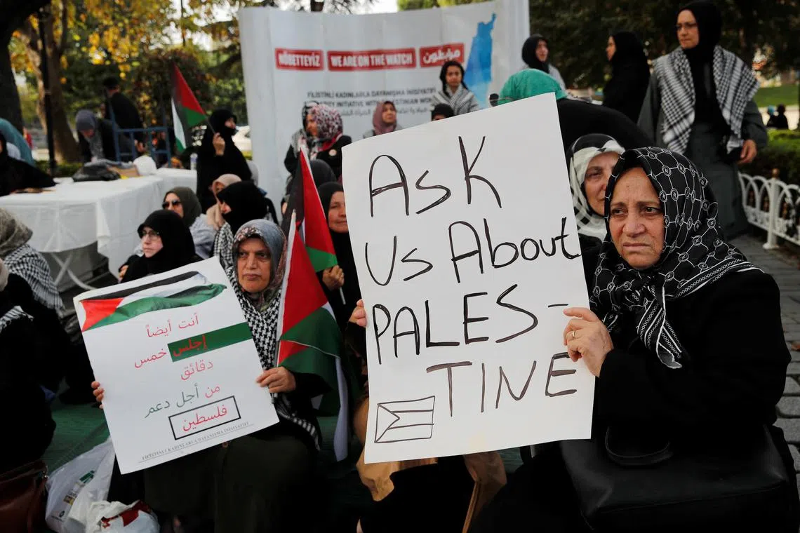 Women take part in a sit-in protest in Istanbul in support of Palestinians in Gaza.