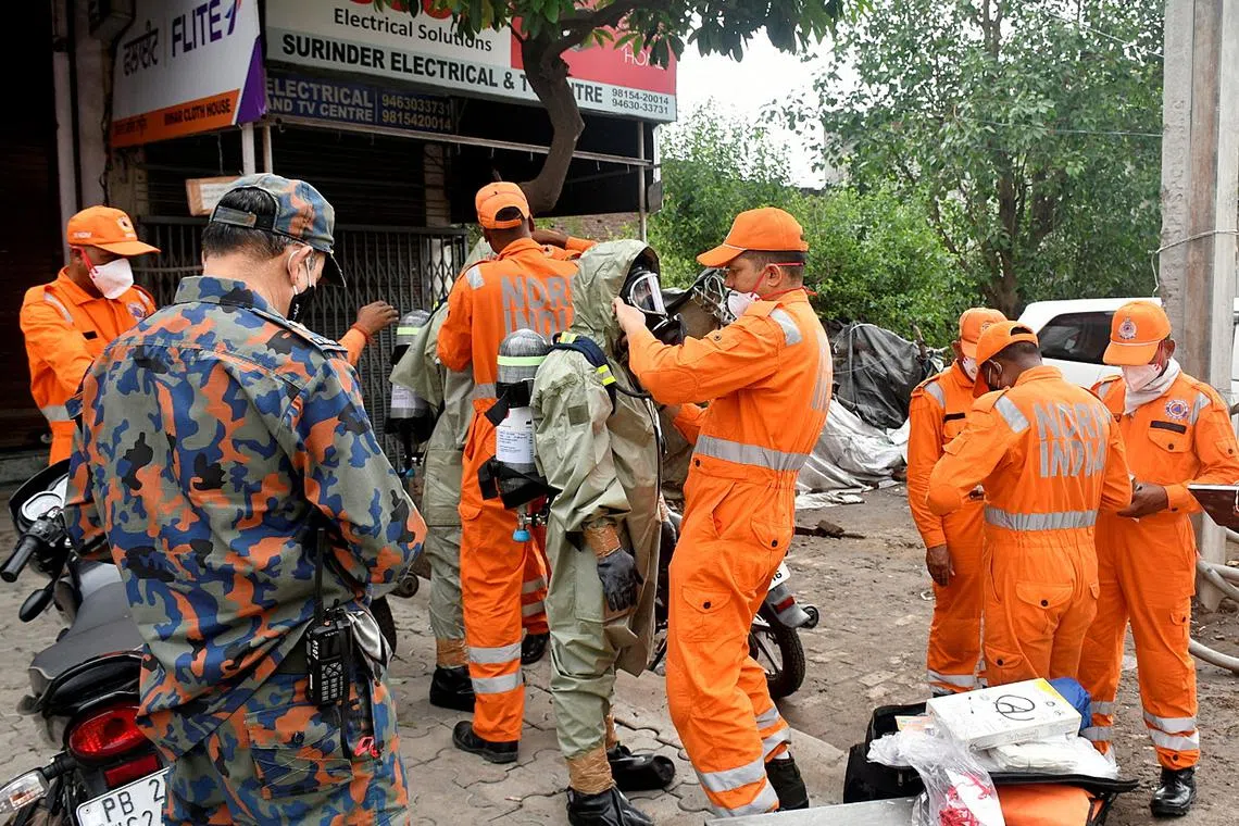 Members of National Disaster Response Force at the site of a gas leak in Ludhiana in the northern state of Punjab, India, on April 30, 2023.