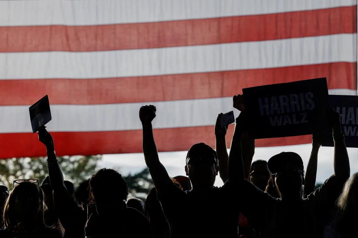 Supporters of Democratic presidential nominee and U.S. Vice President Kamala Harris react during a campaign rally in Charlotte, North Carolina, U.S., November 2, 2024. REUTERS/Jonathan Drake