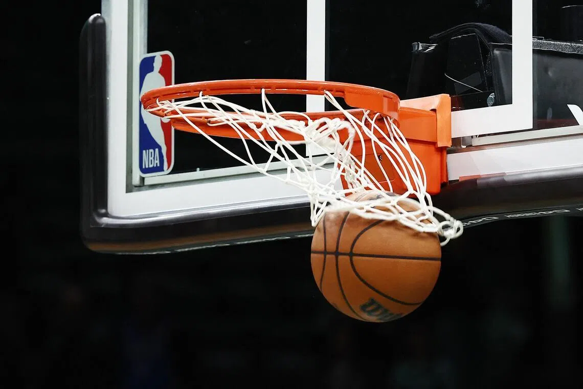 An NBA ball goes through the basket before the game between the Boston Celtics and the Oklahoma City Thunder at TD Garden in Boston on March 25, 2026.