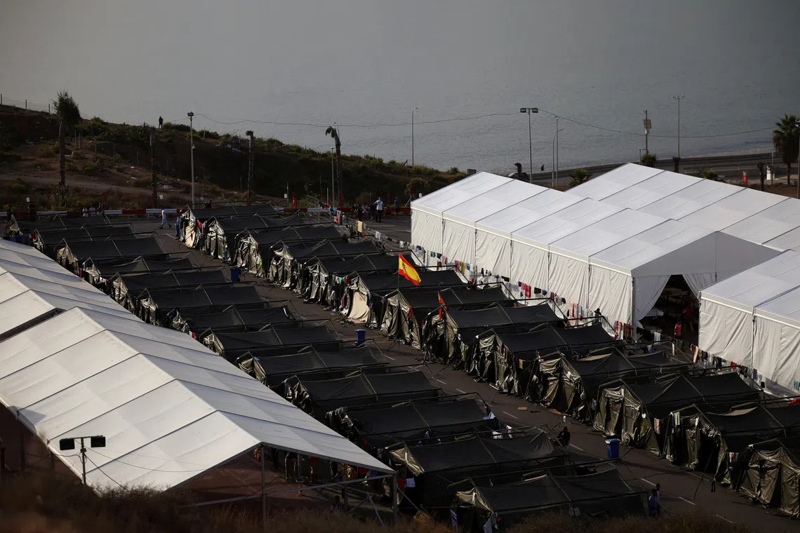FILE PHOTO: Improvised migrant center following recent mass crossings of migrants from Morocco into Ceuta, Spain, October 1, 2026. REUTERS/Pedro Nunes/File Photo