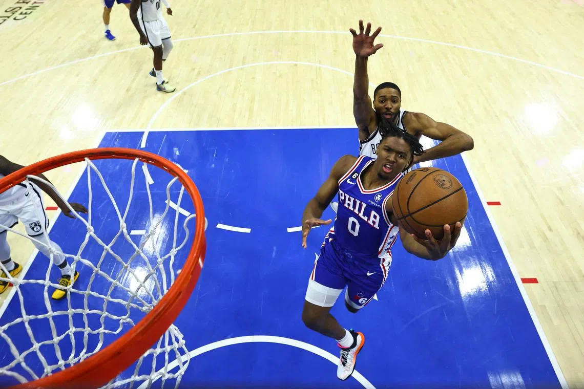 Tyrese Maxey of the Philadelphia 76ers goes up for a layup against Mikal Bridges of the Brooklyn Nets in the first quarter of Game 2 of their NBA play-offs.