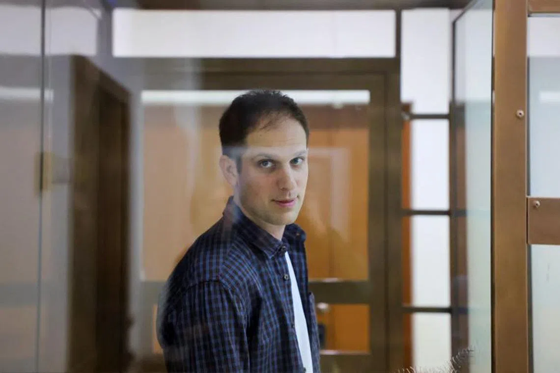 Wall Street Journal reporter Evan Gershkovich stands inside an enclosure for defendants before a court hearing to consider an appeal against his pre-trial detention on espionage charges in Moscow, Russia, October 10, 2023. REUTERS/Evgenia Novozhenina