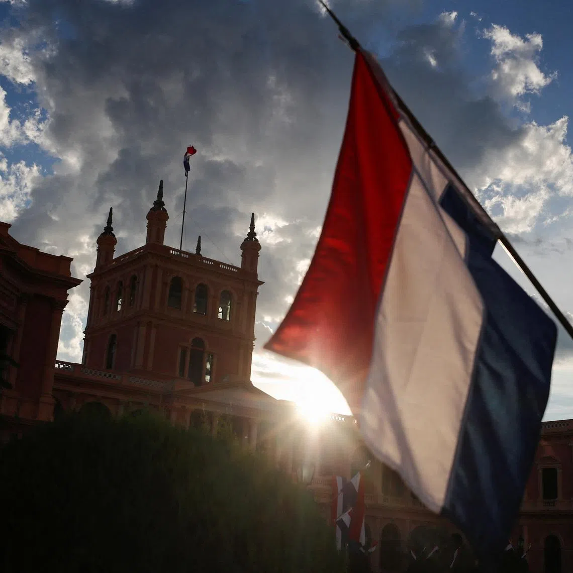 The Paraguayan flag waves outside the Presidential Palace in Asuncion, Paraguay May 1, 2023. REUTERS/Agustin Marcarian