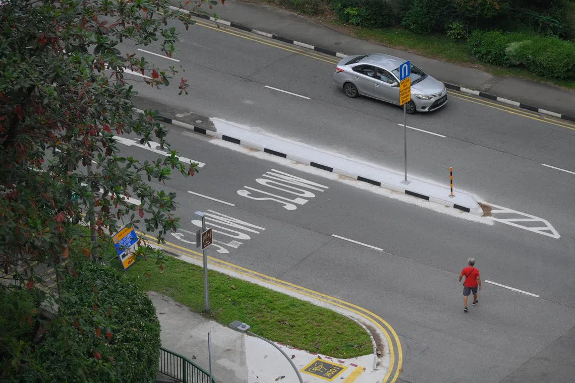 People jay walk across Yuan Ching Road, near the site where a 12-year-old girl was killed after being hit by a van on Jan 30, pictured on Feb 6, 2024.