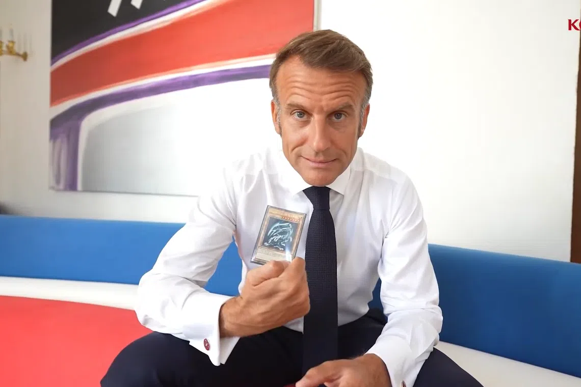 Emmanuel Macron held up the iconic Blue Eyes White Dragon card during his address.