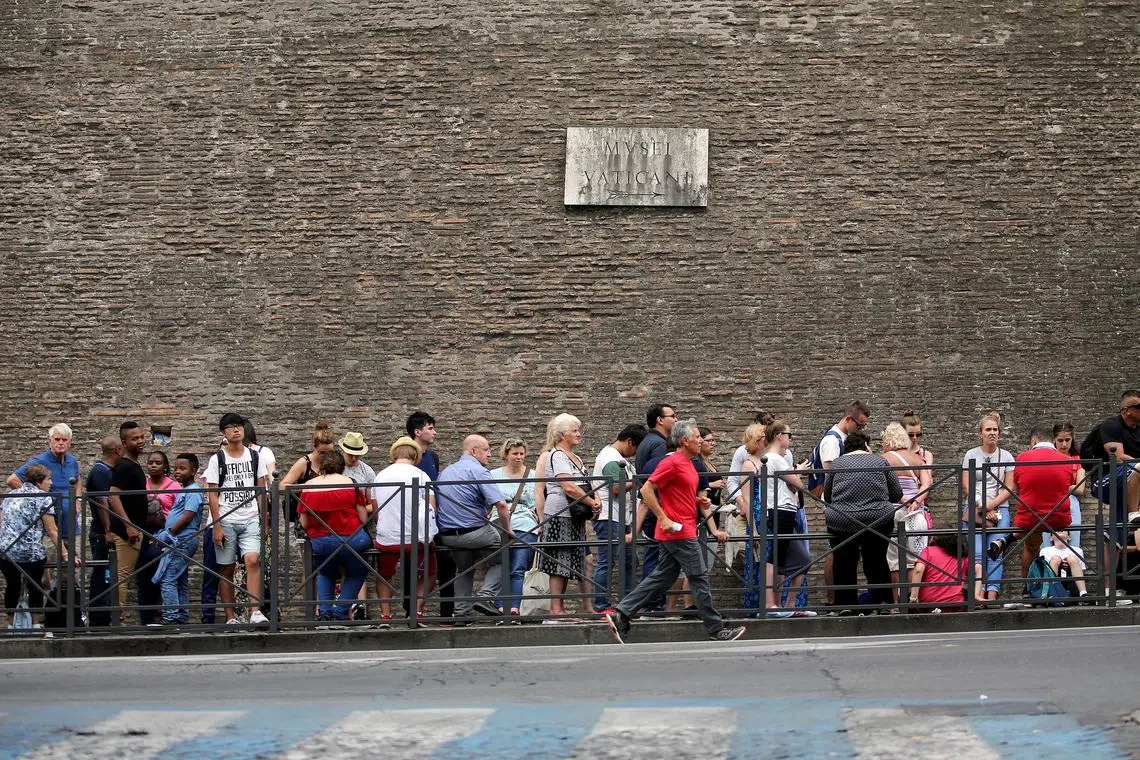 FILE PHOTO: Visitors queue to enter the Vatican Museums, Italy, June 30, 2017.  REUTERS/Alessandro Bianchi/File Photo