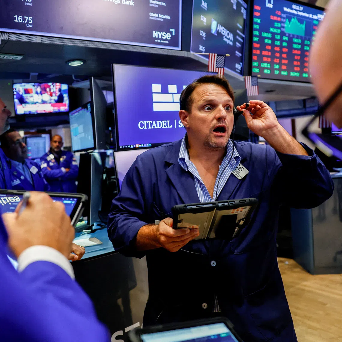 Traders work on the floor of the New York Stock Exchange on Sept 16, in New York City.