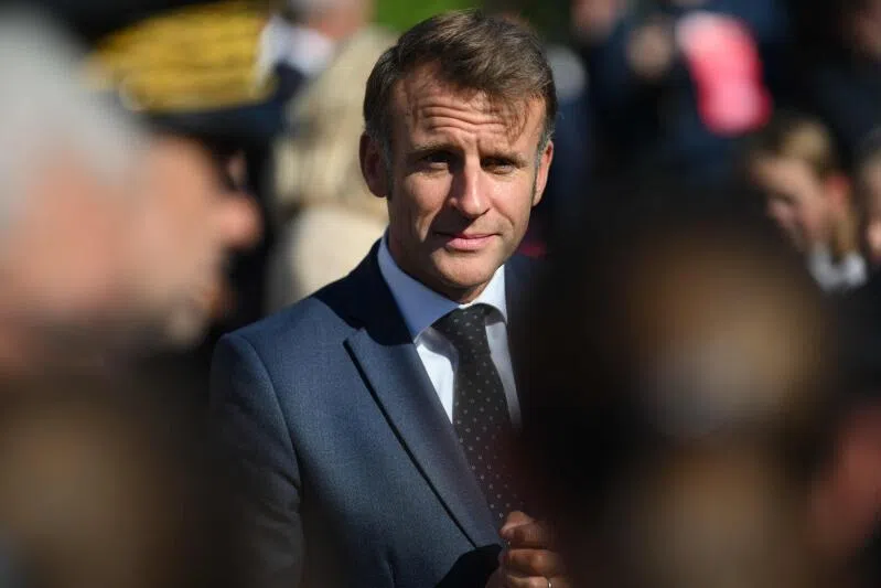 France's President Emmanuel Macron reacts during a visit to the Benedictine abbey of Pontlevoy, as part of the 42nd edition of the European Heritage Days, in Pontlevoy central France, on September 19, 2025. (Photo by Eliot BLONDET / POOL / AFP)